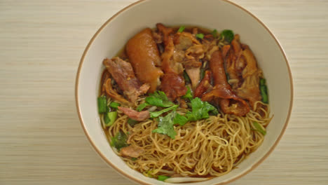 stewed pork leg noodles in brown soup