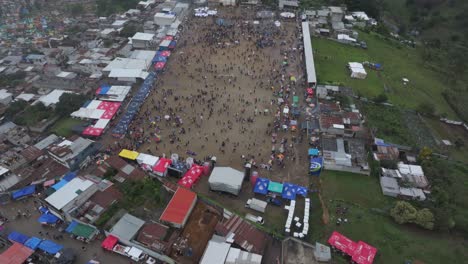 wide shot of sumpango kite festival during a moody day, aerial