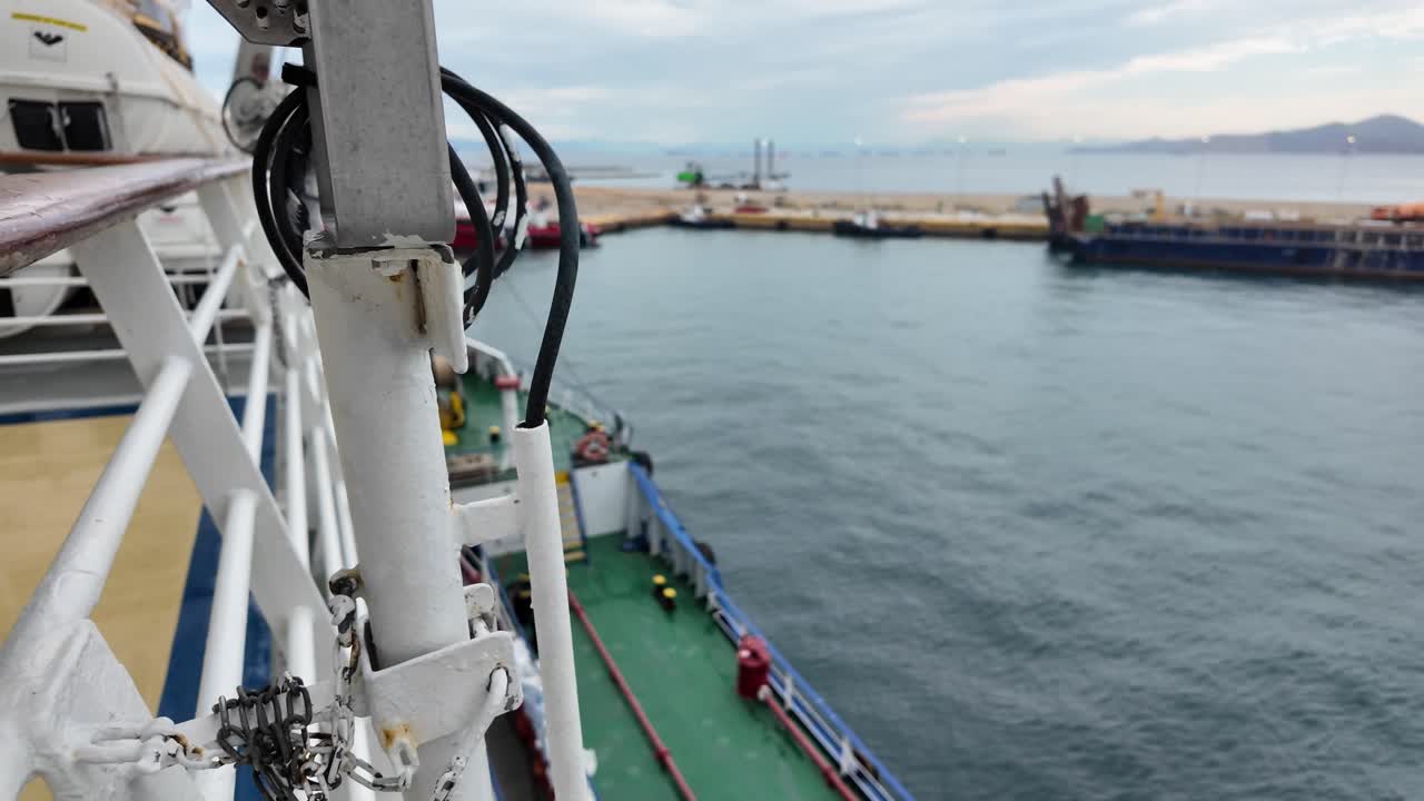 ship refueling barge fueling up a cruise ship in Pireaus, Athens, Greece