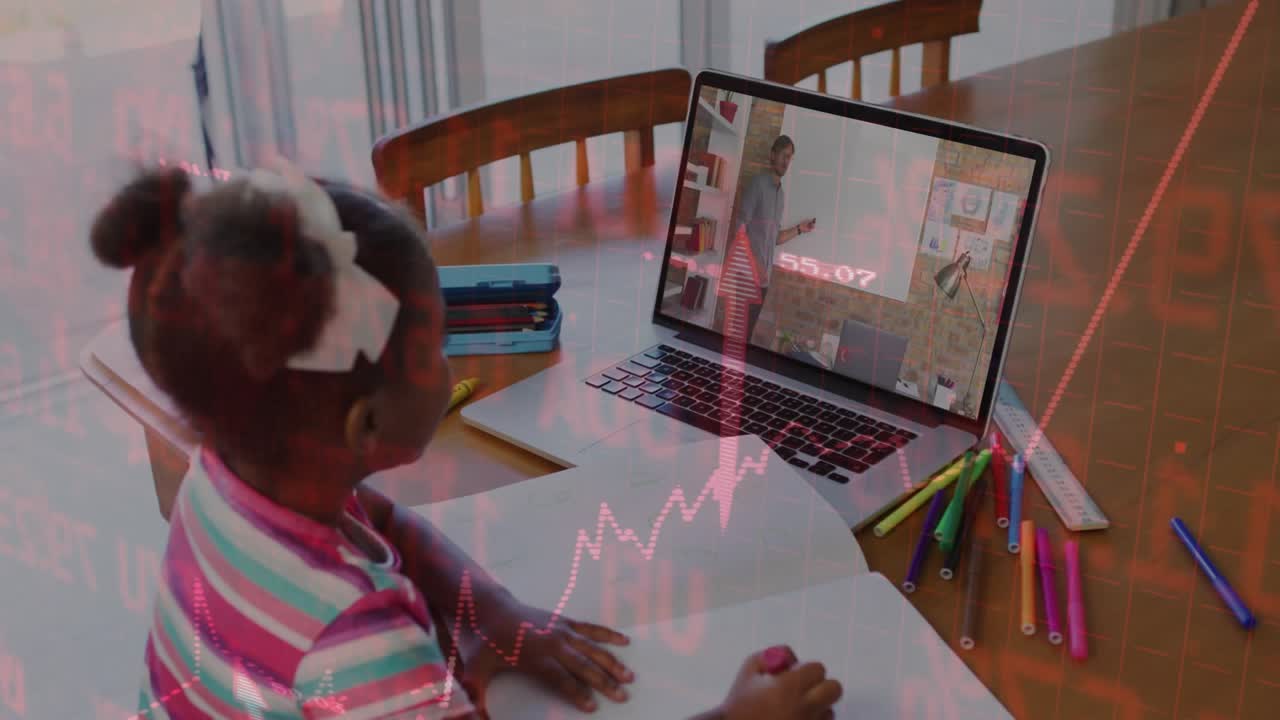Student taking notes on teacher gesture while red chart lines pulsing over laptop in remote lesson