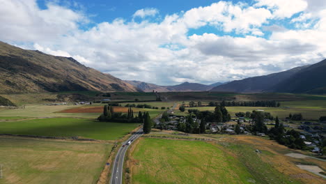 drone approaching kingston town at the southernmost end of lake wakatipu in new zealand's south island