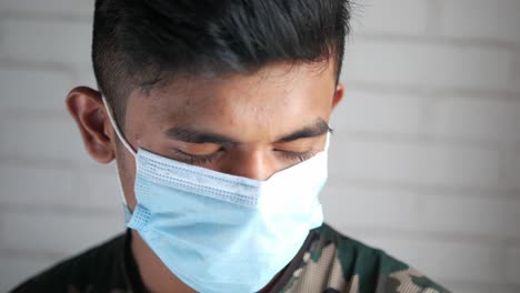 young man wearing a face mask