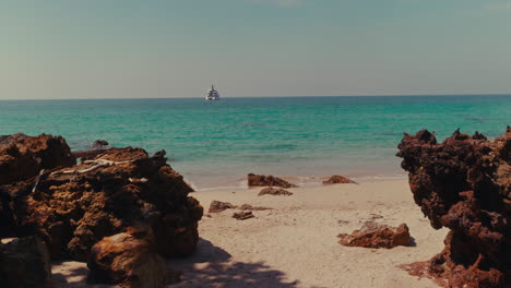 tropical beach with yacht