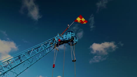 the pulley system of main boom tip sheave on the end of the jib of a blue luffing construction crane