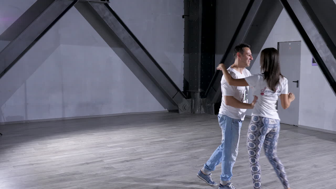 Couple dancing in a studio