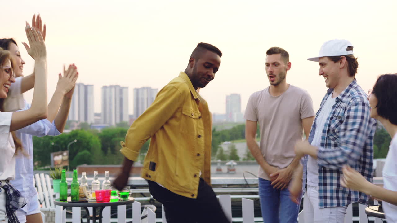Friends Dancing on Rooftop Party