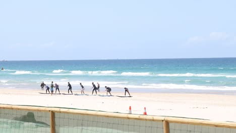 people jogging together along a sunny beach