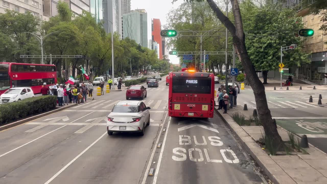 Slow motion shot of public transport system in mexico city in from of senate at morning