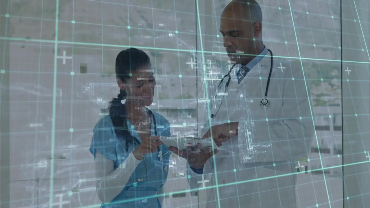 Doctor and Nurse Reviewing Medical Data on Tablet in Hospital