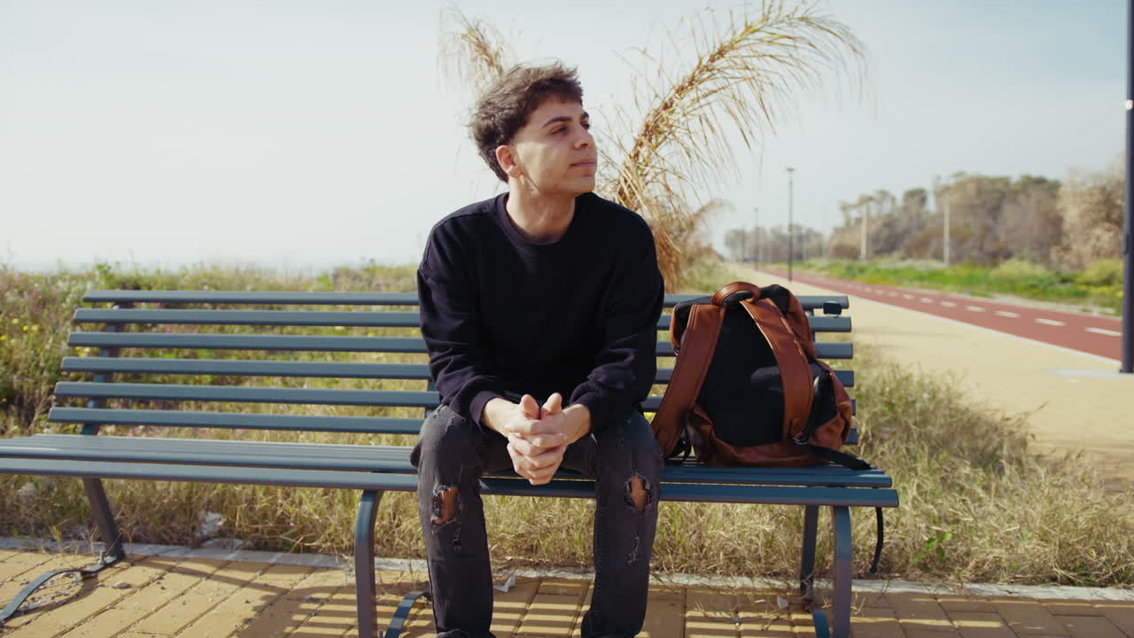 Man On The Bench In The Nature Feeling The Air Breeze And Relaxing