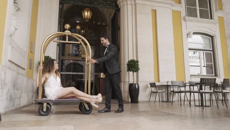 couple having fun at a hotel entrance