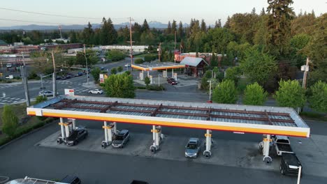 Aerial-view-of-cars-filling-up-at-the-pump