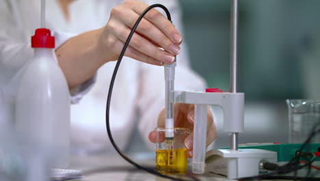 laboratory testing of liquid in lab glassware. laboratory equipment working