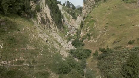 crossing through a naturally created hole with a river in catalonia