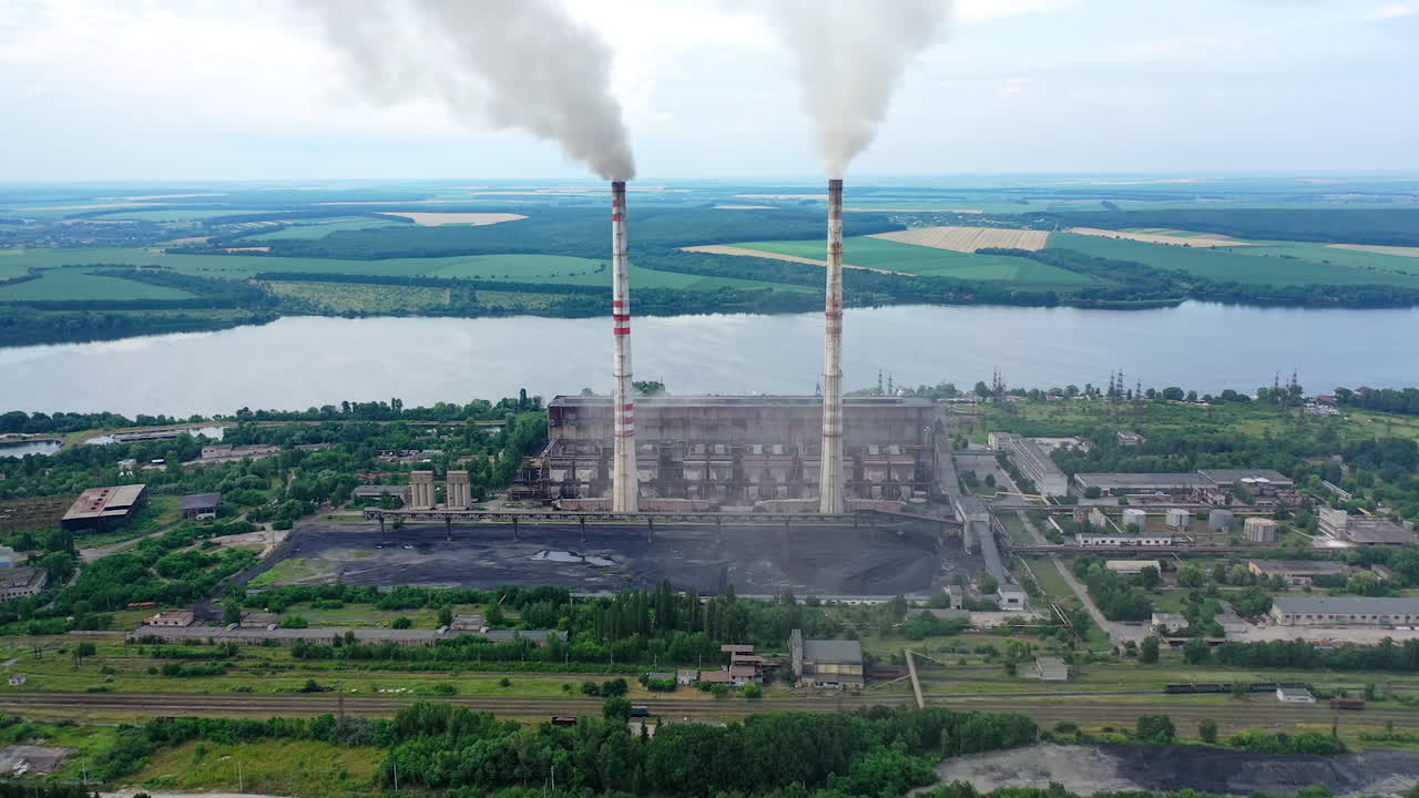 Plant pipes pollute atmosphere. Pollution of the environment of factory pipe with smoke