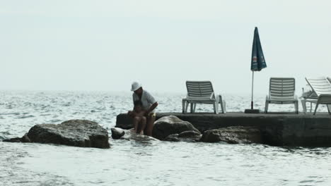 grandparent and grandchild at the beach