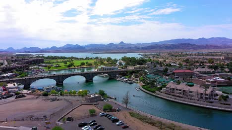 a wide aerial shot panning right looking at the beautiful london bridge in lake havasu city, arizona