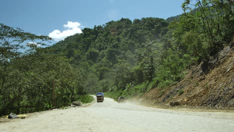 Car-and-lorry-pass-as-another-lorry-approaches-on-Bolivia-road