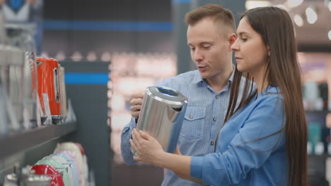 Electric-kettle-for-the-kitchen.-a-couple-chooses-a-suitable-kettle-for-the-design-of-their-kitchen