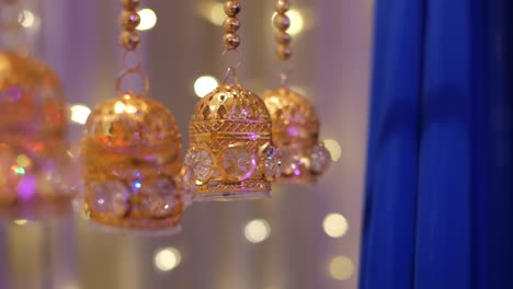 vintage glowing bells decor ornaments during indian mehndi wedding