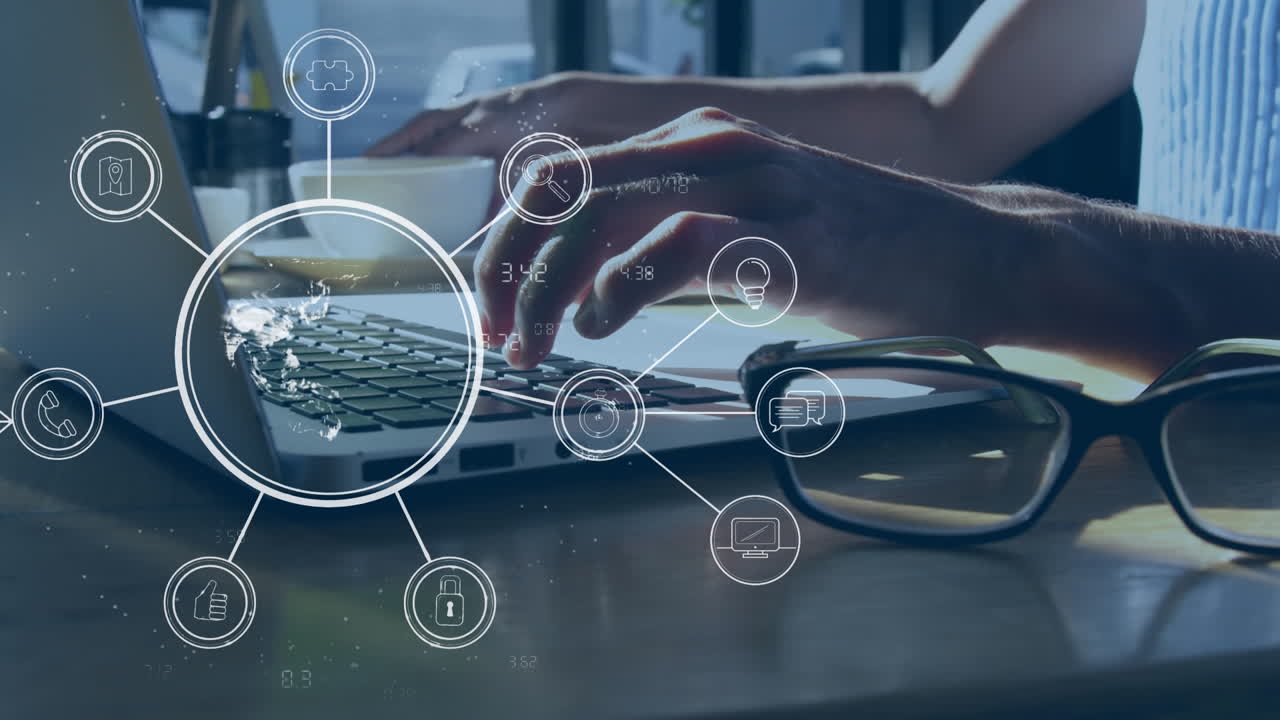 Animation of globe with icons over caucasian businessman using laptop