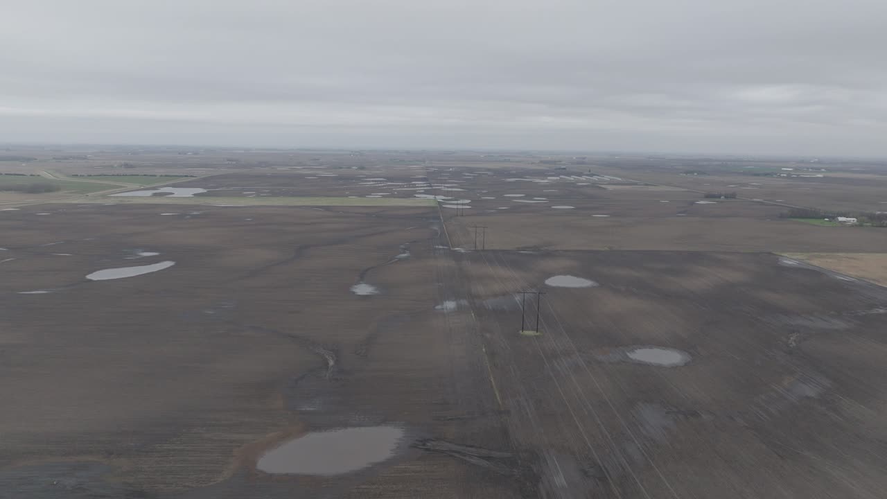 Electrial Overhead Line Over The Rural Fields On A Foggy And Gloomy Day. - aerial shot