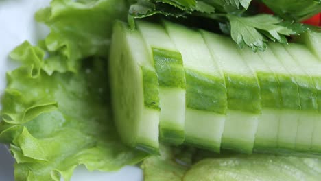 sliced cucumber salad with greens