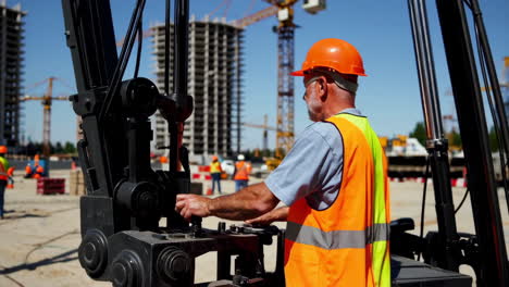 construction worker operating heavy machinery on a construction site