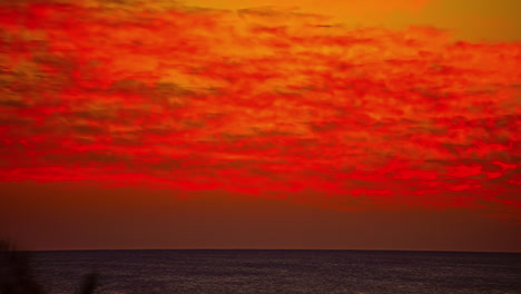 puesta de sol del océano rojo, vista de lapso de tiempo de fusión