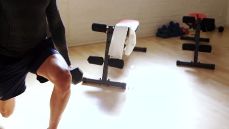 man exercising with dumbells 4k