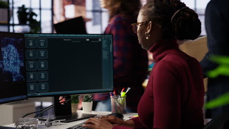 IT engineer interacts with AI LLM chatbot on PC in software development startup