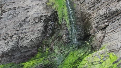 Small-waterfall-at-New-Quay-in-Wales