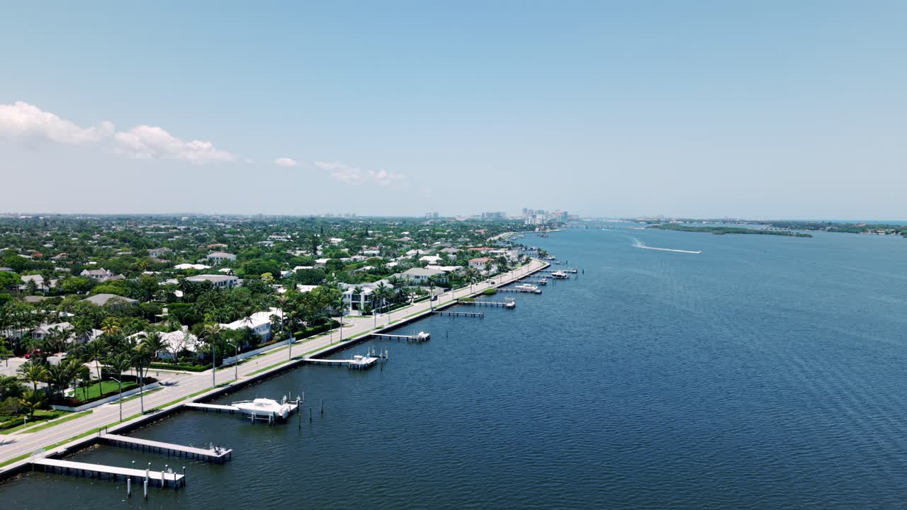Drone over ocean near West Palm Beach and Flagler Beach waterfront city area
