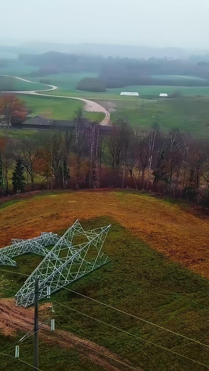 High Voltage Pole, Transmission Tower On The Ground - Drone, Vertical Shot