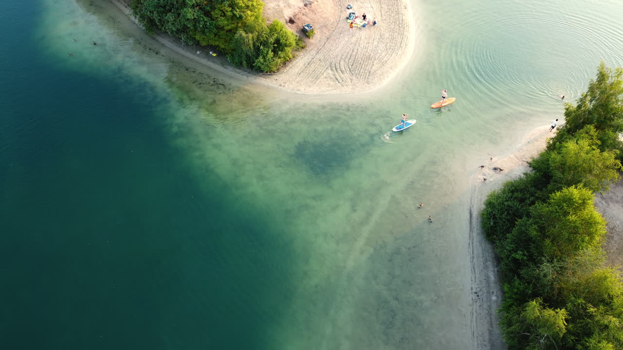 Aerial View of a Lakeside Beach with Activities