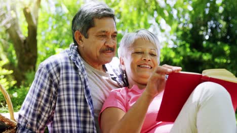 Senior-couple-reading-book