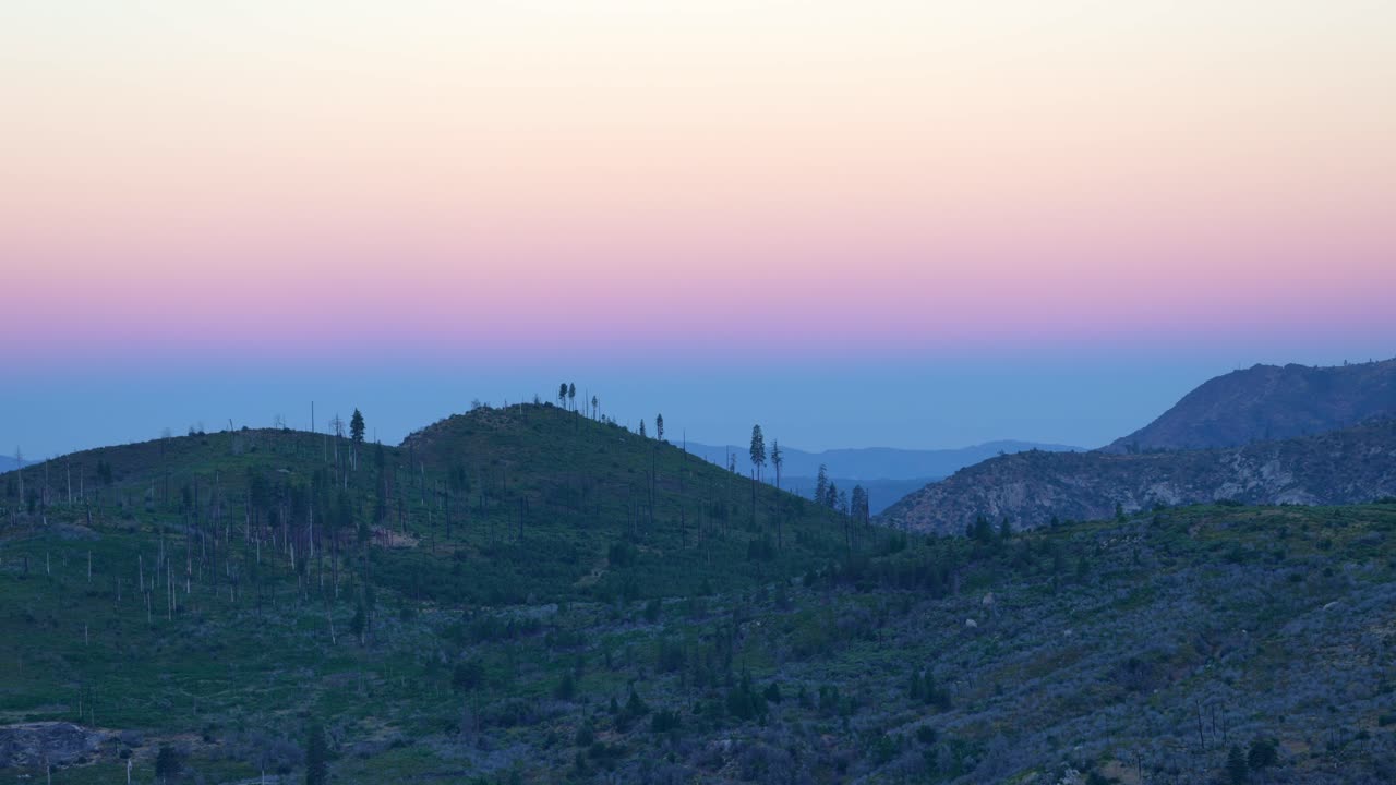 Twilight Sky Above Yosemite Landscape, highlighting the soft fading light on the mountains and natural landscape. Perfect for atmospheric, nature, and travel content