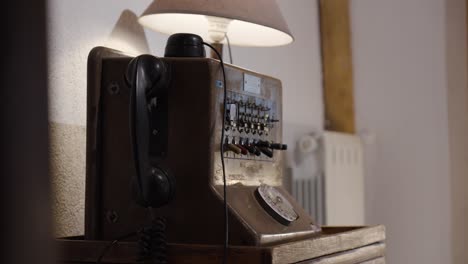 slow establishing shot of a first-generation rotary phone with dials