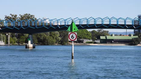 bridge and waterway with speed limit sign