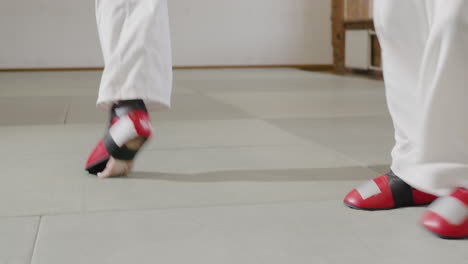 two athletes fighting indoors