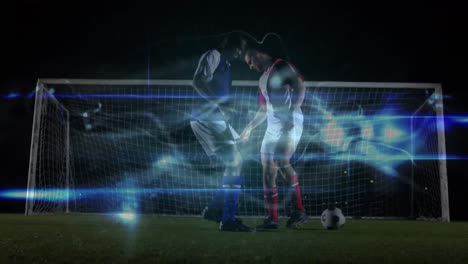 Animation-of-blue-digital-waves-over-two-diverse-male-soccer-player-playing-soccer