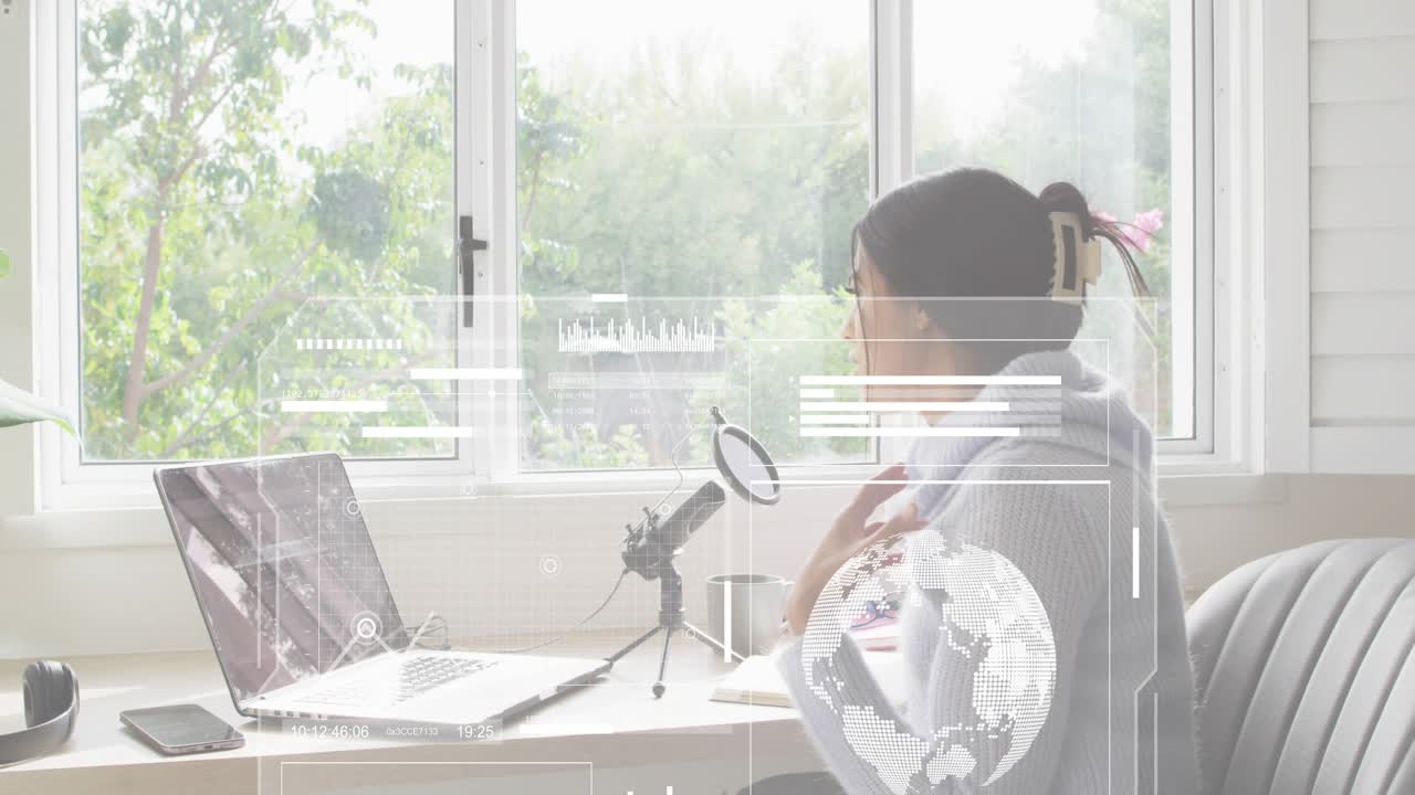 Female streamer settling at desk and starting tech live stream with rotating globe, data visuals