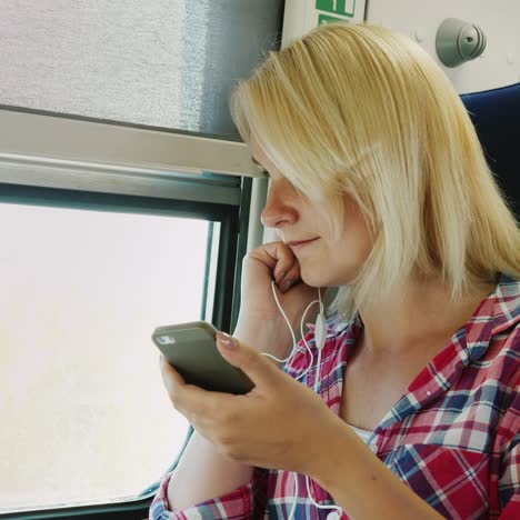 a young woman is using app on a smartphone