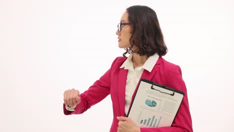 professional businesswoman checking her watch while holding a business report