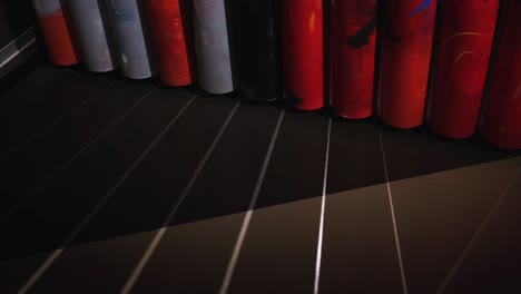abstract cylindrical wall with geometric patterns and shadows