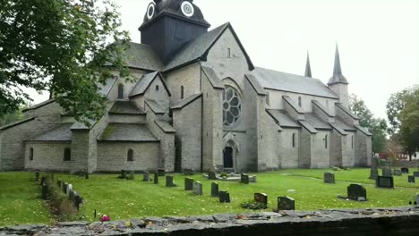 Fast-panning-shot-of-the-Varnhem-abbey-church-and-graveyard-in-Sweden