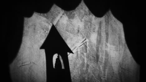 shadow of a house on a stage curtain