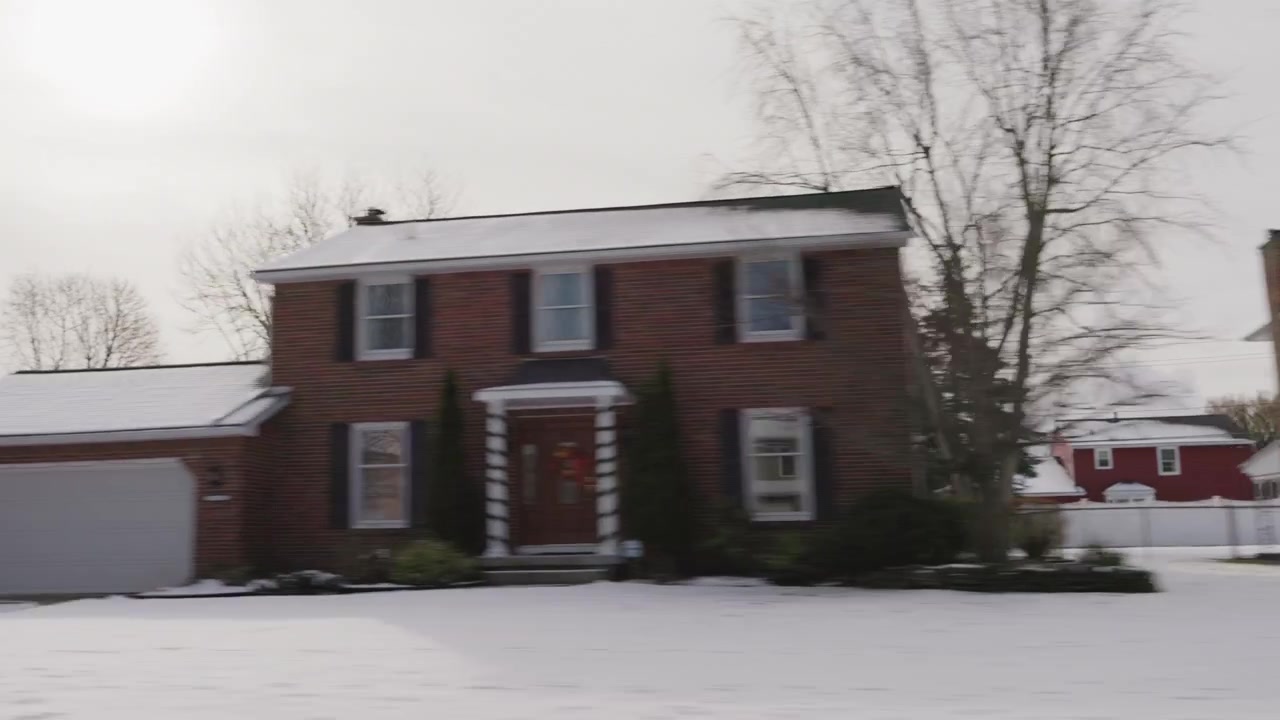 Snowy American town viewed from a moving car