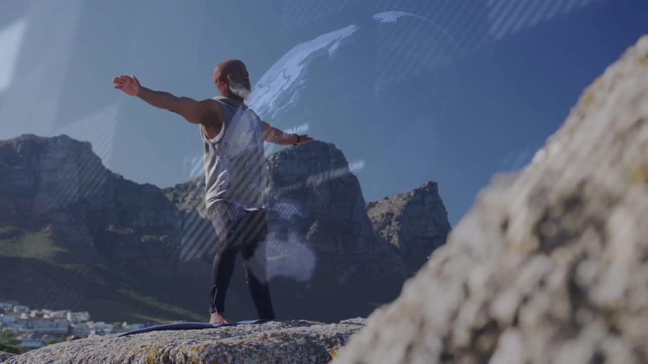 Uomo che si bilancia, spostandosi su una roccia, con un globo e strisce che si sovrappongono a lui, svanendo e poi riemergendo per il fitness.