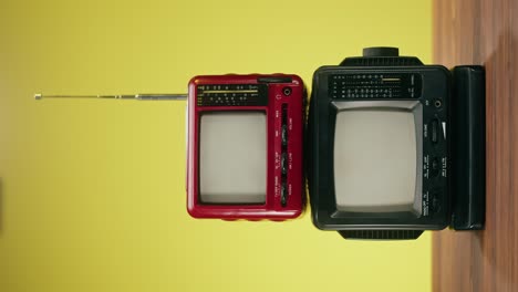 two vintage portable televisions